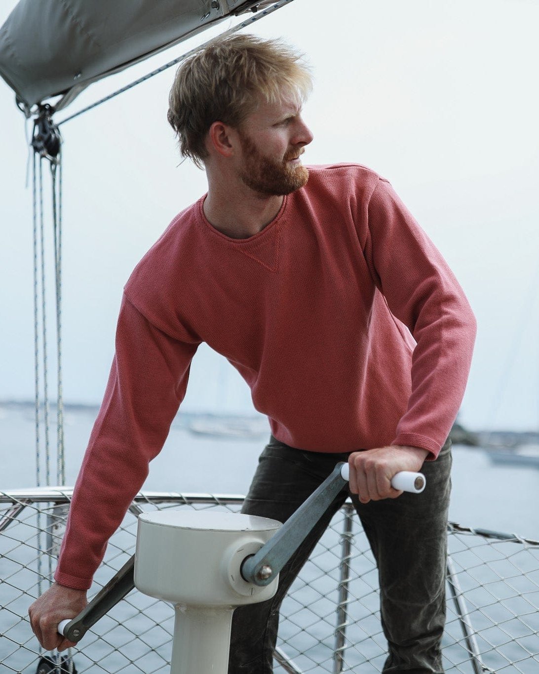 Whalerknits Chatham Jersey Sweatshirt Pullover: A man in Nantucket Red leans over a sailboat winch.