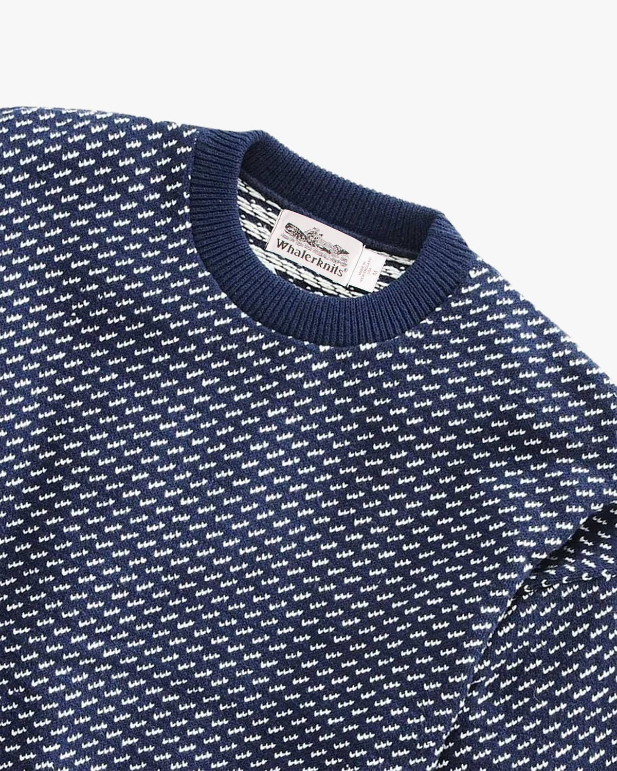 Whalerknits Sakonnet Birdseye Crewneck Pullover: Close-up of the navy and natural birdseye knit, ribbed collar and Whalerknits label.