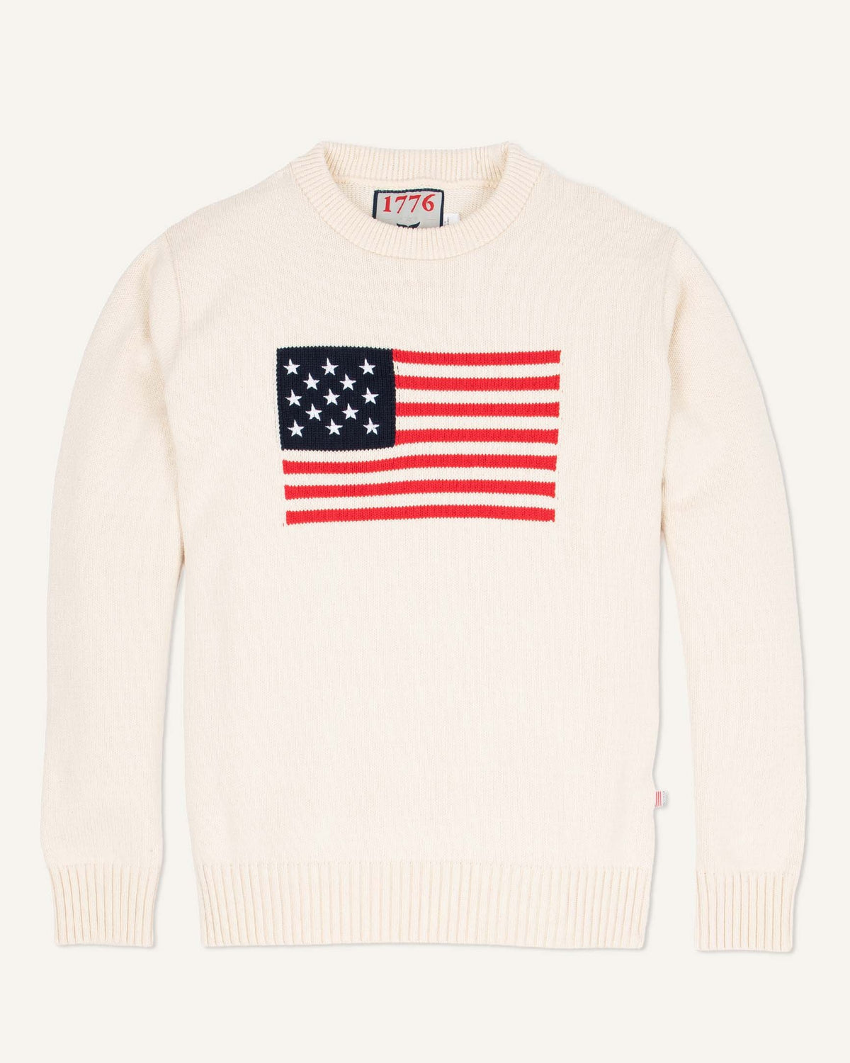 Whalerknits Bristol - American Flag Crewneck: Natural sweater laid flat with a red, white and blue American flag across the chest. #Color_Natural