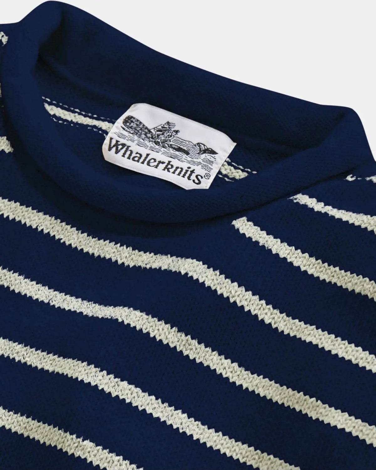 Whalerknits Nantucket Rollneck Sweater: Close-up of the navy and natural striped neckline, knit stitches and label.