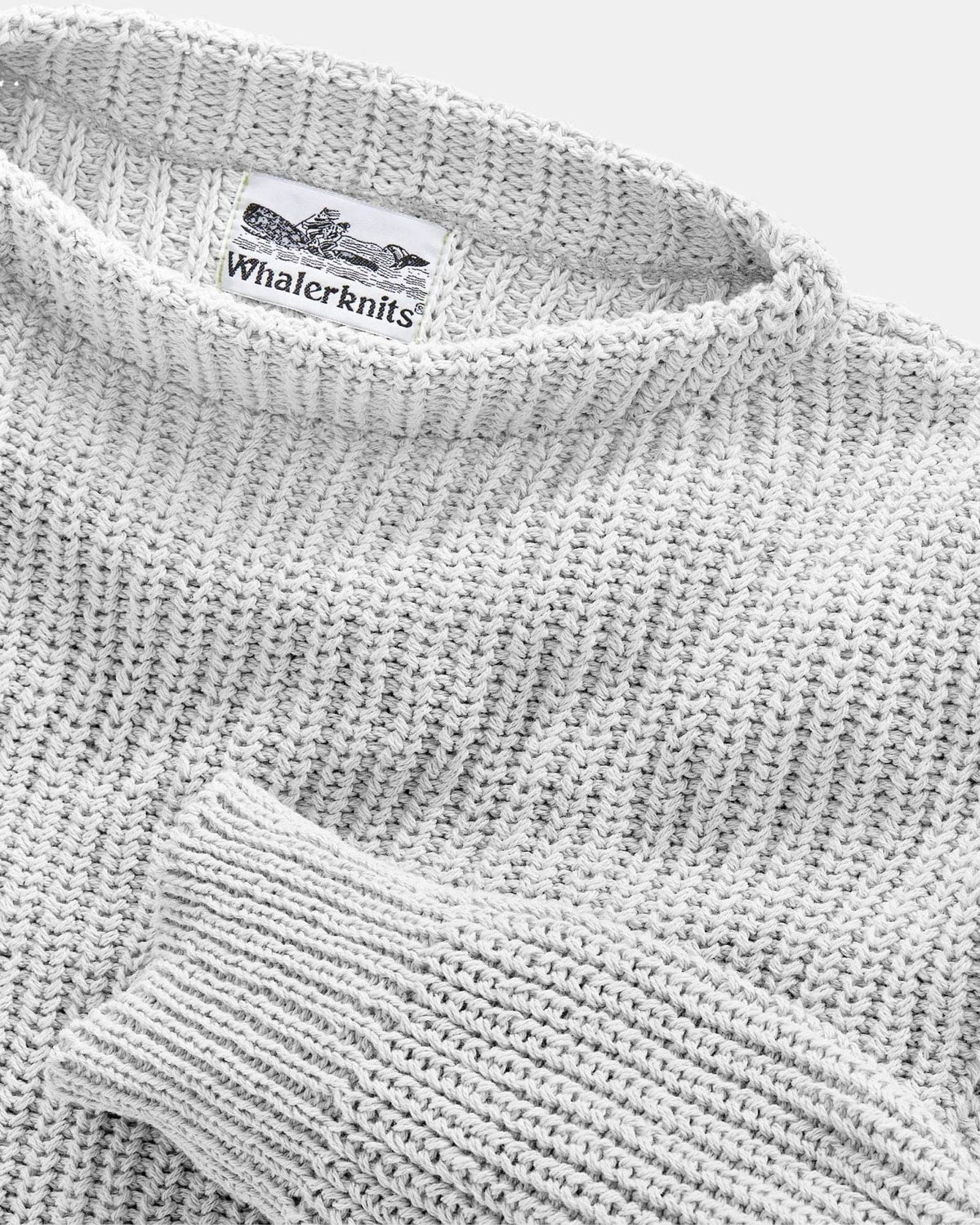 Whalerknits Newport Shaker Boatneck Sweater: Close-up of the light natural-colored neckline, ribbed cuff and knit texture.