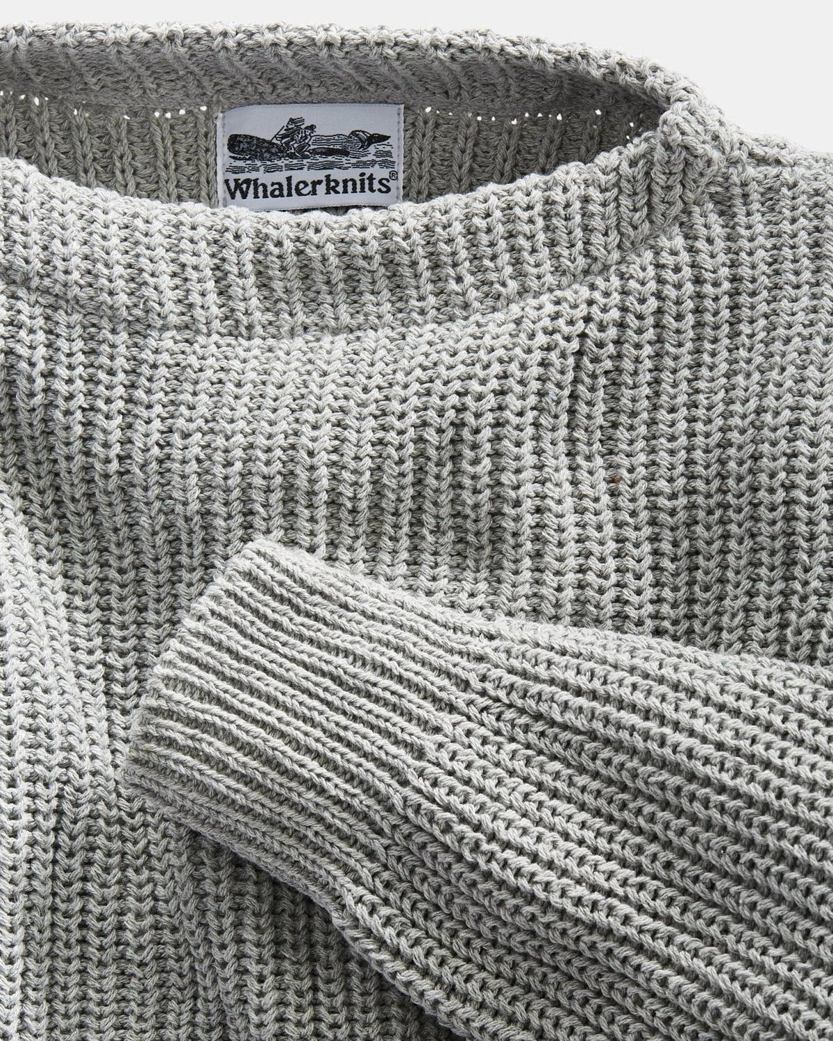 Whalerknits Newport Shaker Boatneck Sweater: Close-up of the gray boat neckline, ribbed sleeve and Whalerknits label.