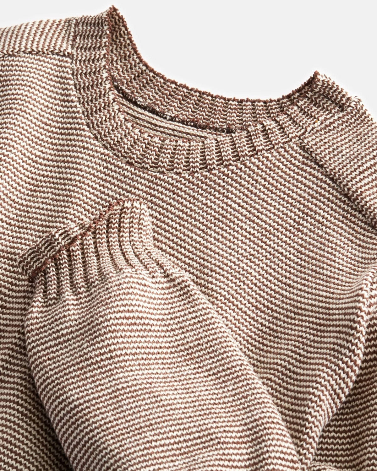 Whalerknits Westport Crewneck Saddle Shoulder Pullover: Close-up of the brown and natural crew neckline and ribbed cuff.