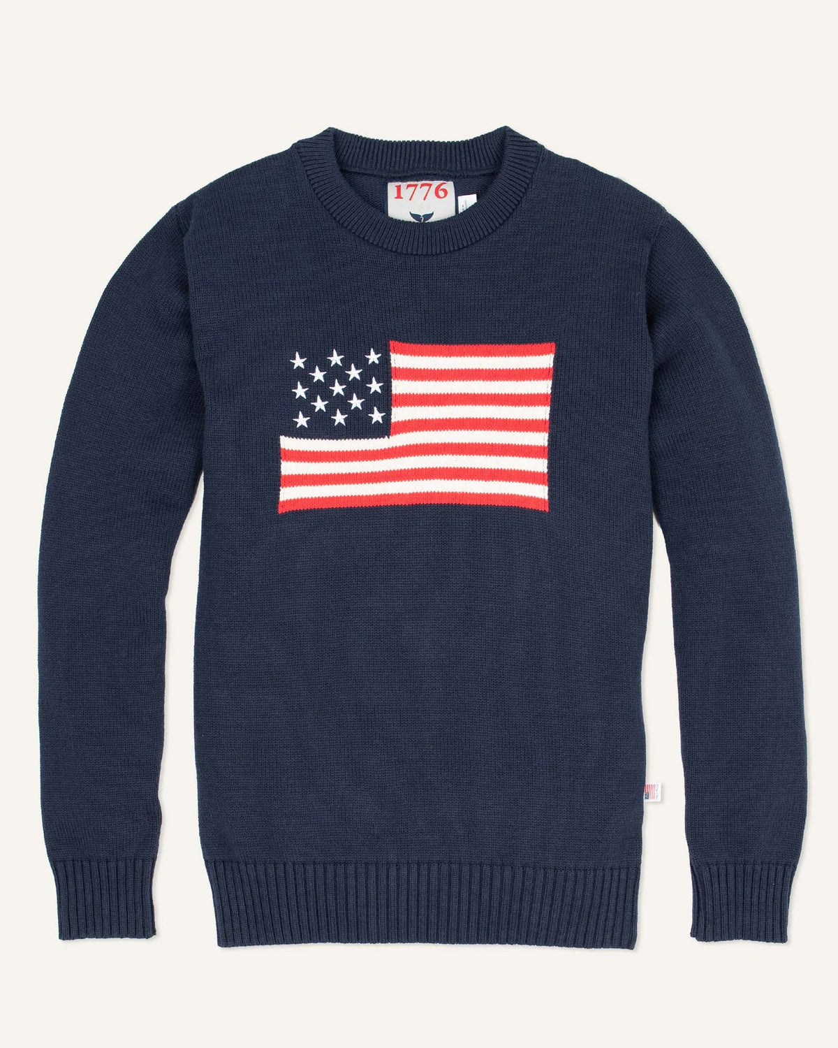 Whalerknits Bristol - American Flag Crewneck: Navy sweater laid flat with a red, white and blue American flag across the chest. #Color_Navy