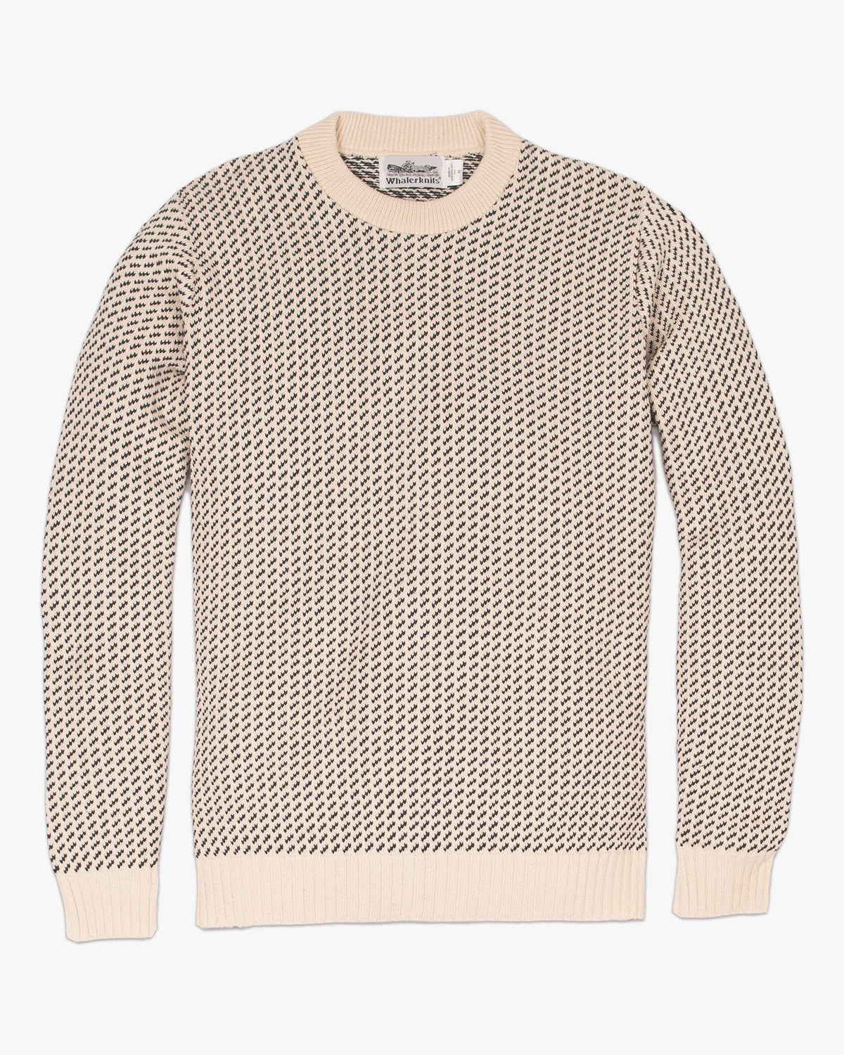 Whalerknits Sakonnet Birdseye Crewneck Pullover: Natural sweater with navy birdseye pattern laid flat, showing solid ribbed collar, cuffs and hem.