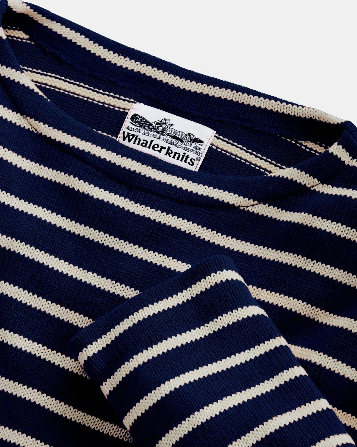 Whalerknits Nantucket Classic Boatneck Sweater: Close-up of the navy and natural striped boat neckline, cuff and label.
