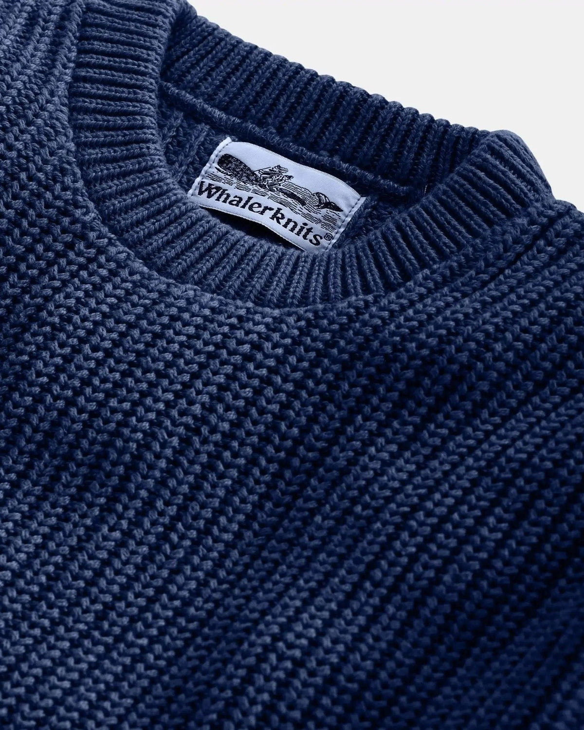 Whalerknits Newport Shaker Knit Crewneck Sweater: Close-up of the navy neckline, shaker-knit ribs and Whalerknits label.