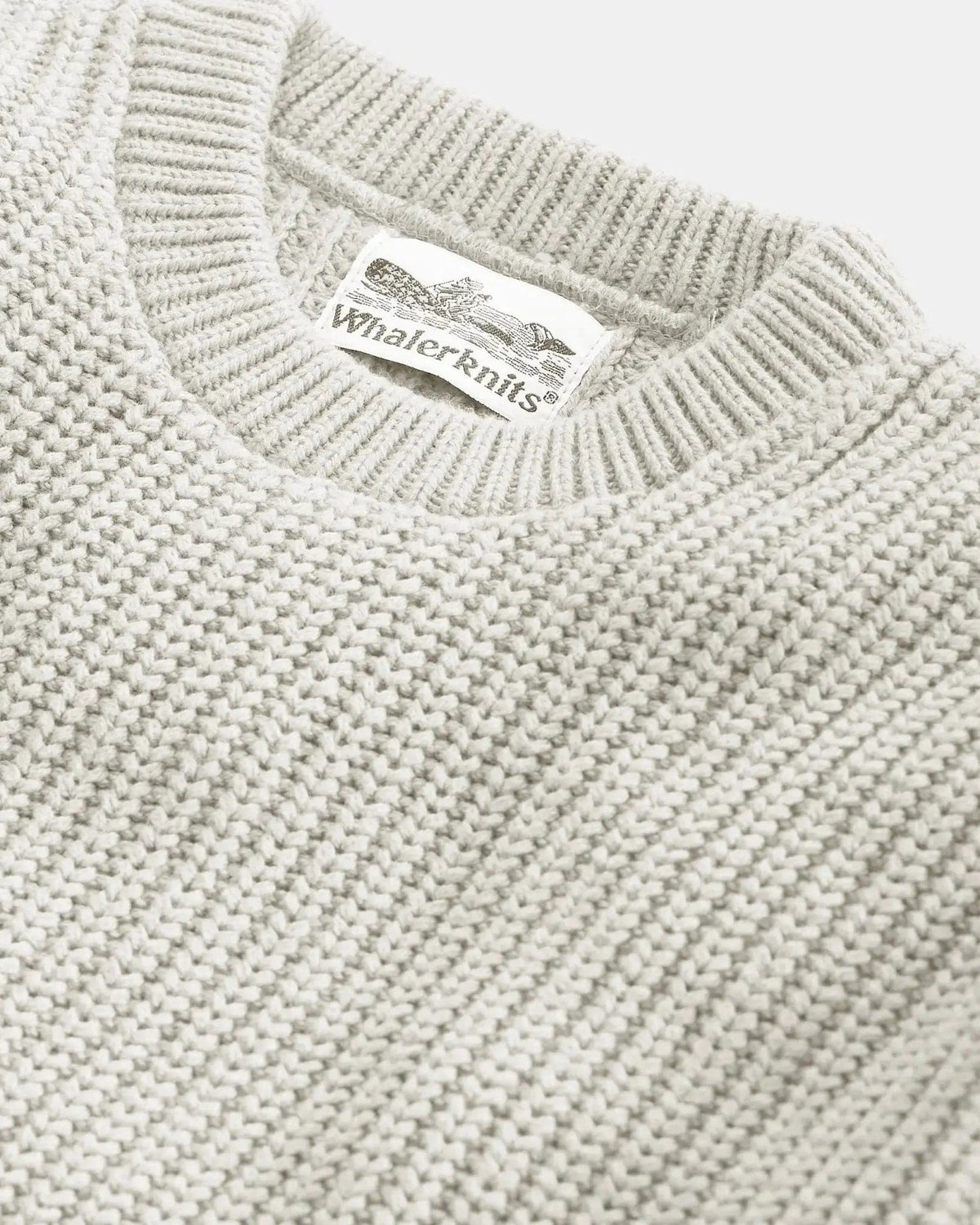 Whalerknits Newport Shaker Knit Crewneck Sweater: Close-up of the light natural-colored neckline, knit texture and label.