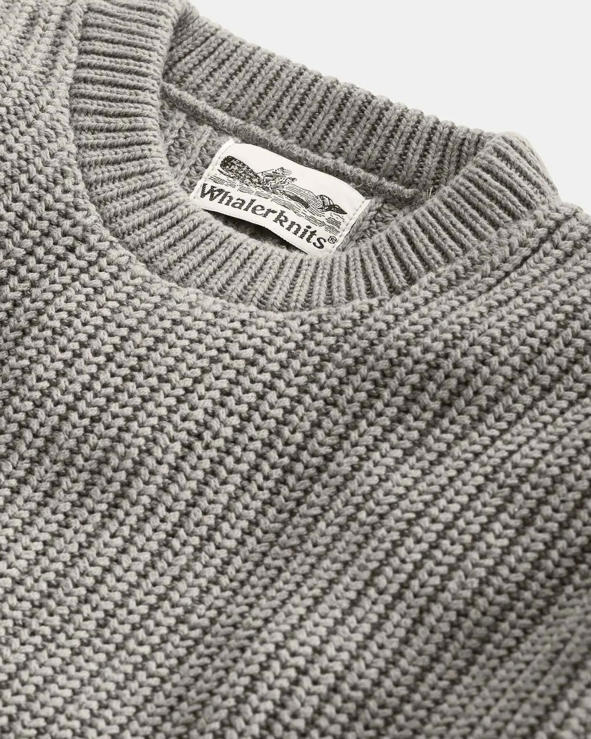 Whalerknits Newport Shaker Knit Crewneck Sweater: Close-up of the gray crew neckline, shaker-knit ribs and Whalerknits label.